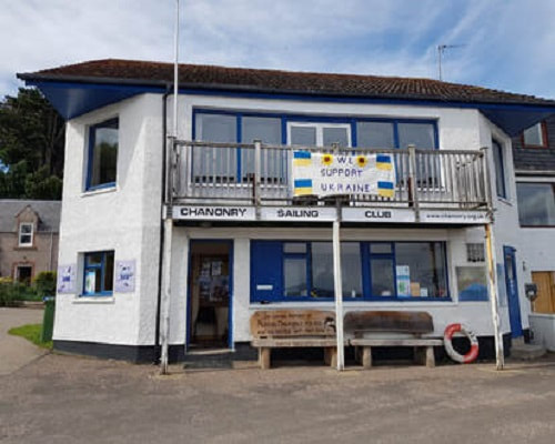 Front of Chanonry Sailing Club clubhouse showing flag in support of Ukraine.